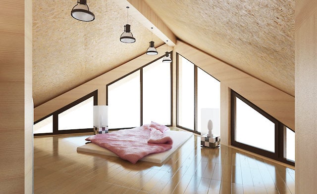 Una casa a tre piani in legno cilindrato 